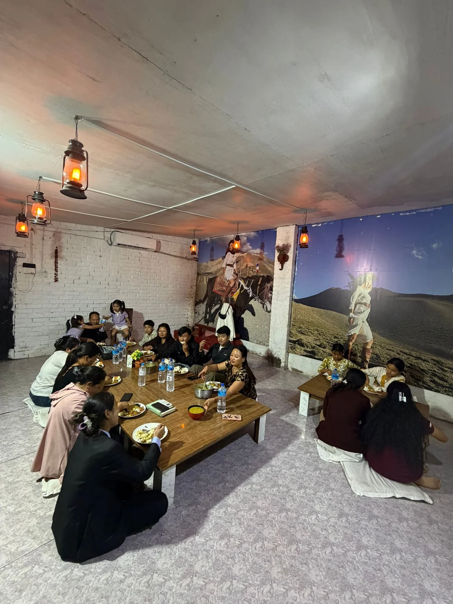 Church family sharing a meal together in Nepal