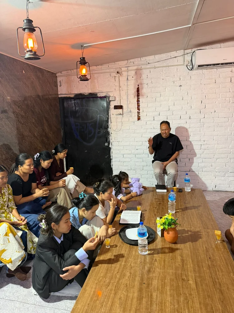 Yubaraj teaching a house church gathering in Nepal